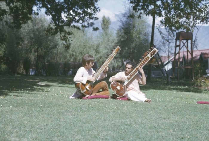 George Harrison takinga  sitar lesson from Ravi Shankar in India